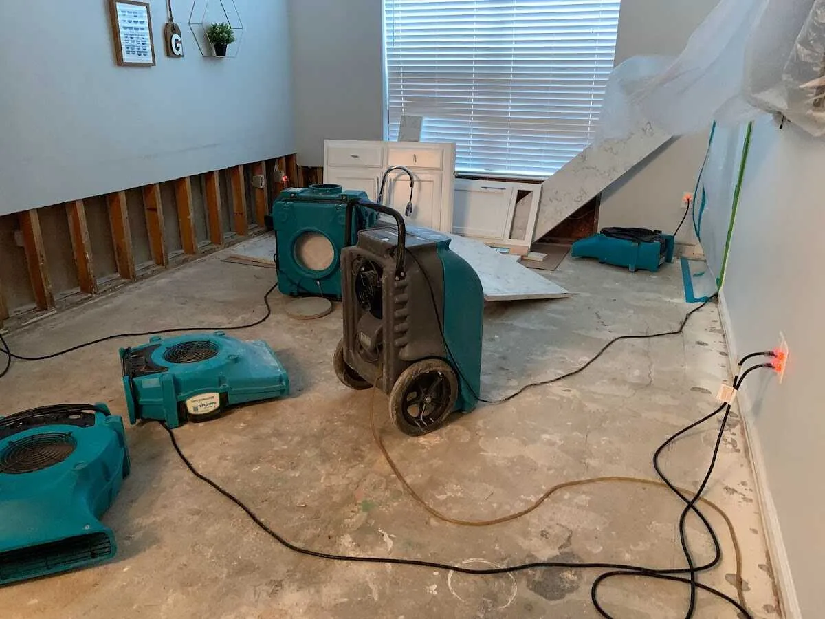 Dehumidifier in flood-cut room for Water Damage Restoration in Eldorado at Santa Fe